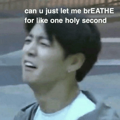 a man is making a funny face with a caption that says `` can u just let me breathe for like one holy second ''