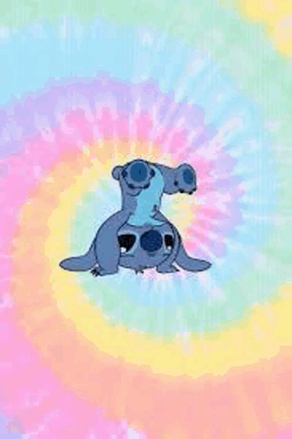 a tie dye background with a cartoon character sitting on top of another cartoon character .