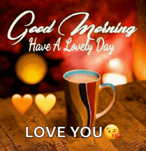 a cup of coffee on a wooden table with hearts and the words good morning have a lovely day love you