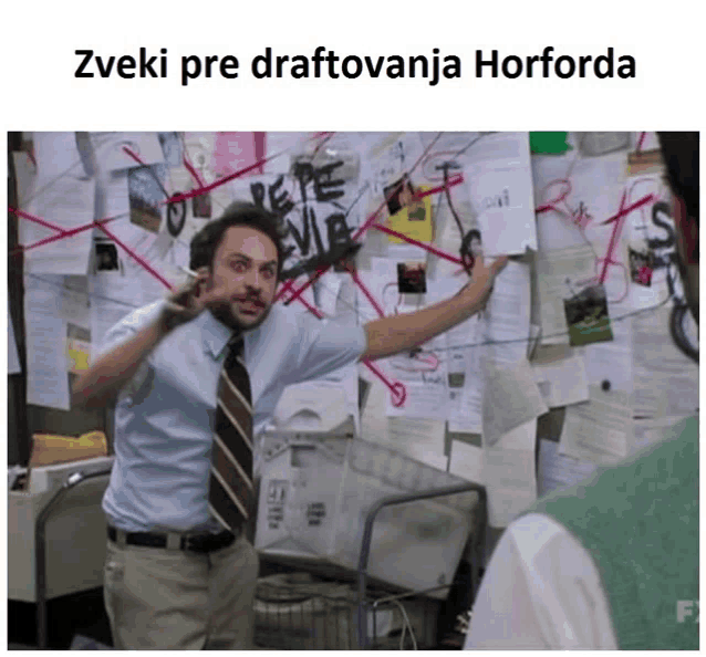 a man standing in front of a bulletin board that says ' zveki pre draftovanja horforda '