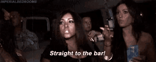 a woman is sitting in the back of a car with her arms in the air and says `` straight to the bar '' .