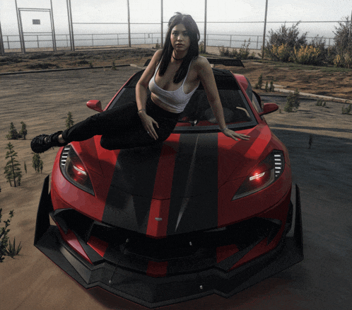 a woman is sitting on the front of a red and black sports car