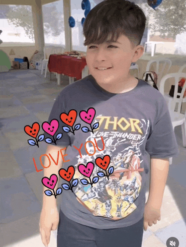 a boy wearing a thor love thunder shirt