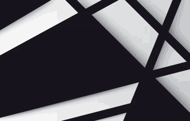 a black and white geometric pattern with a triangle in the middle