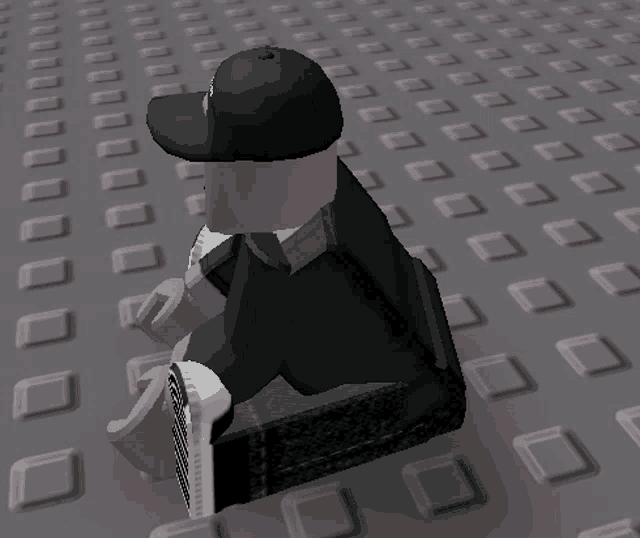 a cartoon character wearing a black hat is sitting on a block