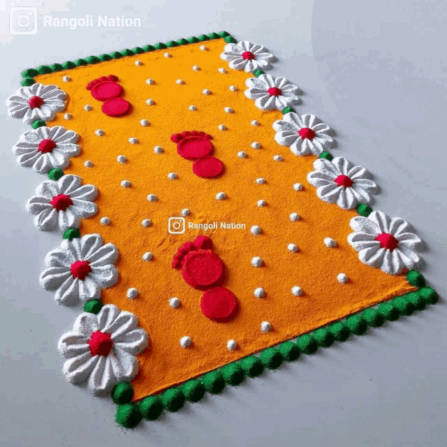 a rug that has flowers and footprints on it and the words rangoli nation on the bottom