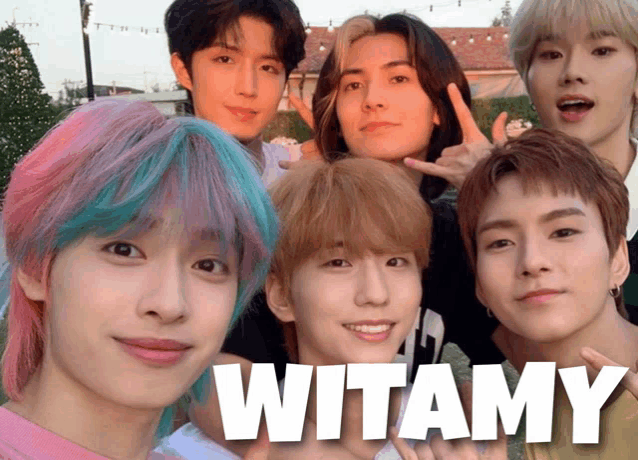 a group of young men are posing for a picture with the words witamy in the corner