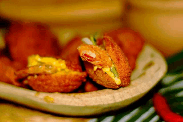 a close up of fried food with a bite taken out of it