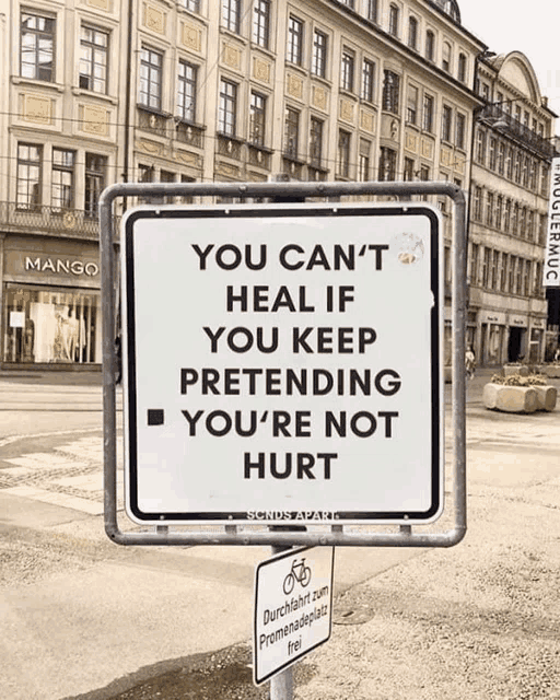 a sign that says " you can t heal if you keep pretending you 're not hurt "