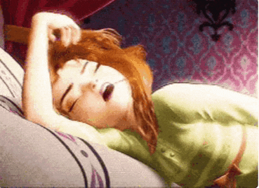 a cartoon character is sleeping on a bed with her eyes closed and her mouth open .