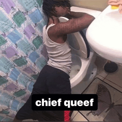 a man is sitting on a toilet in a bathroom with the words `` chief queef '' above him .