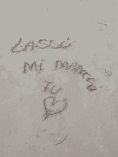 the word lassi is written in the sand