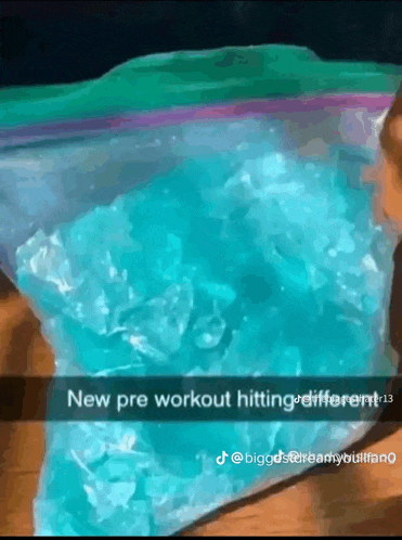 a bag of blue ice sits on a table next to a caption that says new pre workout hitting different