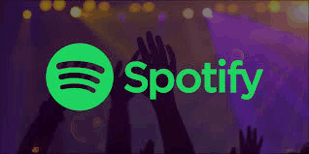 a spotify logo with people 's hands in the air