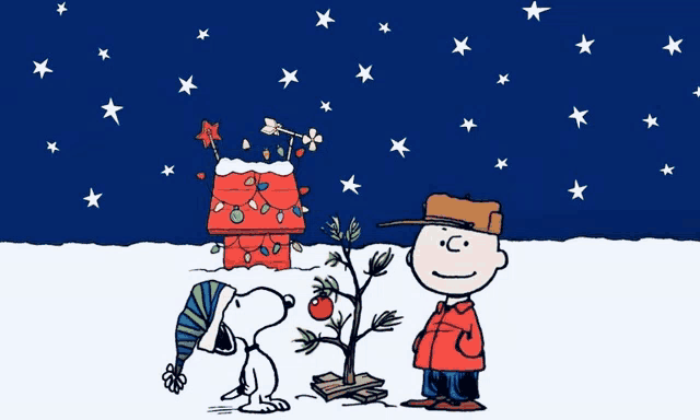 a cartoon of snoopy and charlie brown with a christmas tree