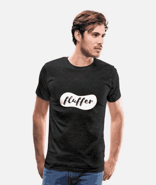 a man wearing a black t-shirt that says fluffer on it