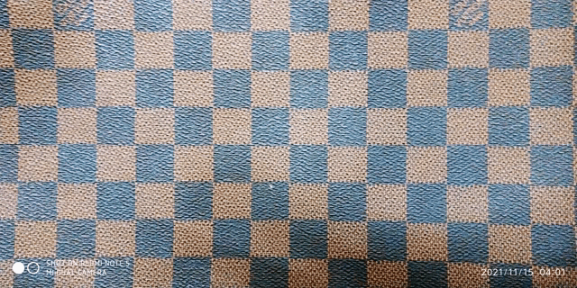 a close up of a checkered pattern on a piece of fabric