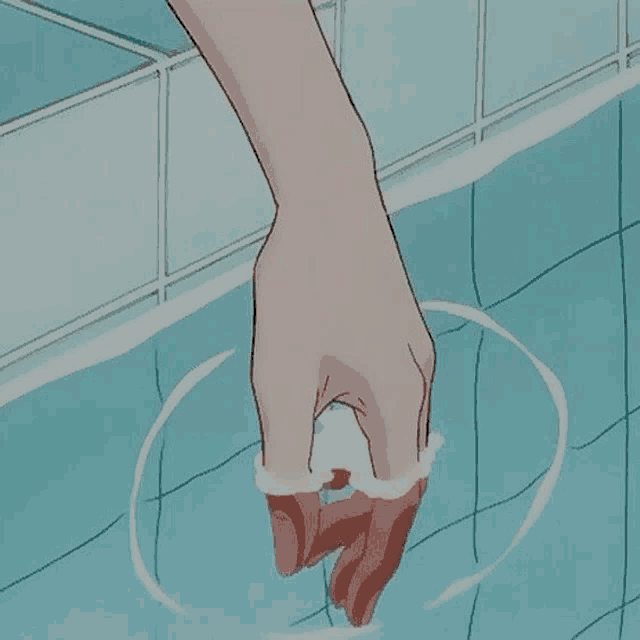 a person 's hand is sticking out of a pool of water .