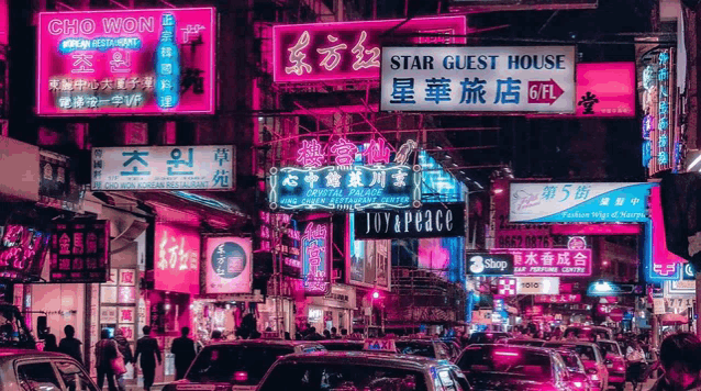 a busy street with a sign that says joy & peace on it