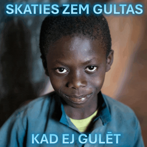 a picture of a young boy with the words skaties zem gultas