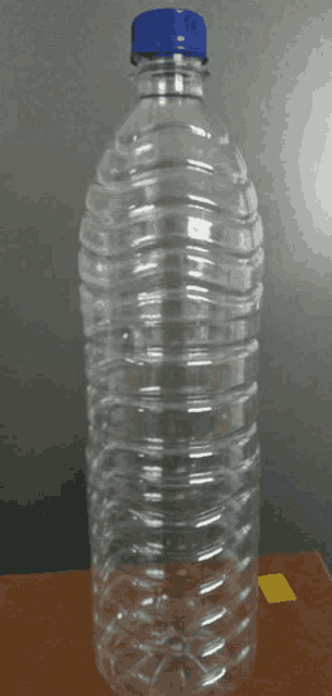 a clear plastic water bottle with a blue cap