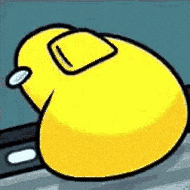 a yellow duck is sitting on a table in a video game .