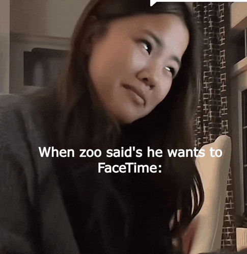 a woman is sitting in front of a screen that says ' when zoo said 's he wants to facetime ' on it