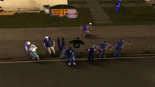 a group of people standing on a sidewalk in front of a sign that says work zone