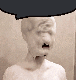 a statue of a man with foam on his face and a speech bubble above his head