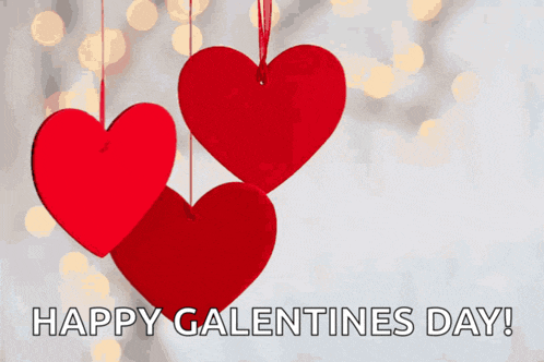 a happy galentines day greeting card with red hearts hanging from a string