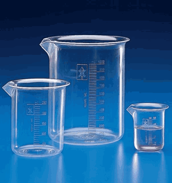 three clear plastic measuring cups with measurements on them are sitting on a blue surface