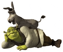 shrek is laying on the ground with a donkey sitting on his back .