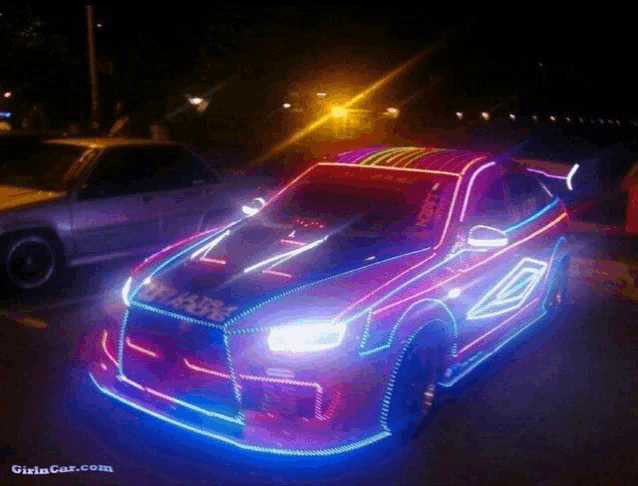 a picture of a car with neon lights on it is taken from girlincat.com