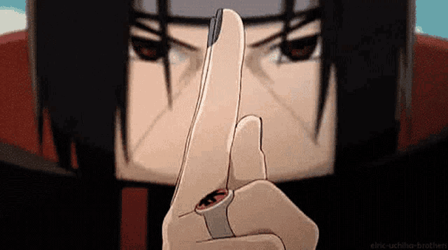 a close up of itachi uchiha 's finger with a ring on it .