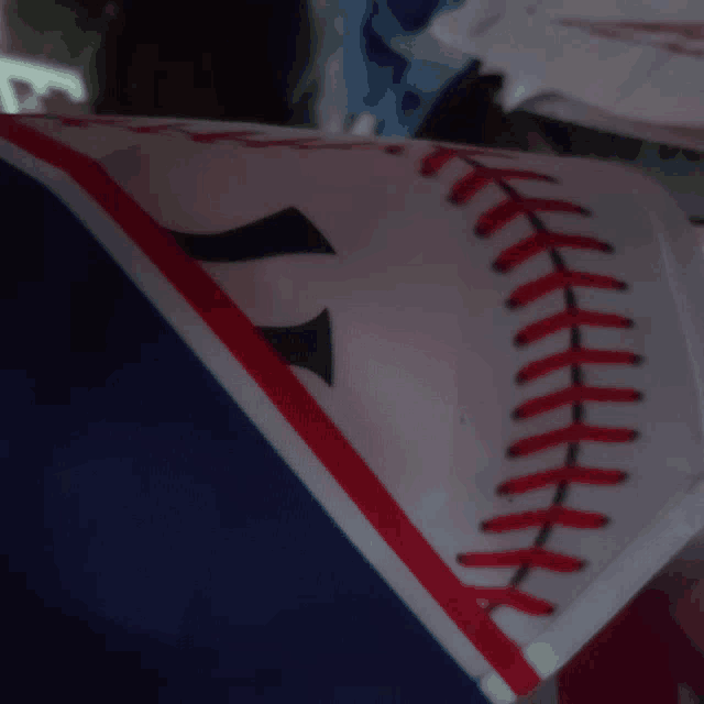 a close up of a baseball jersey with the letter y on it