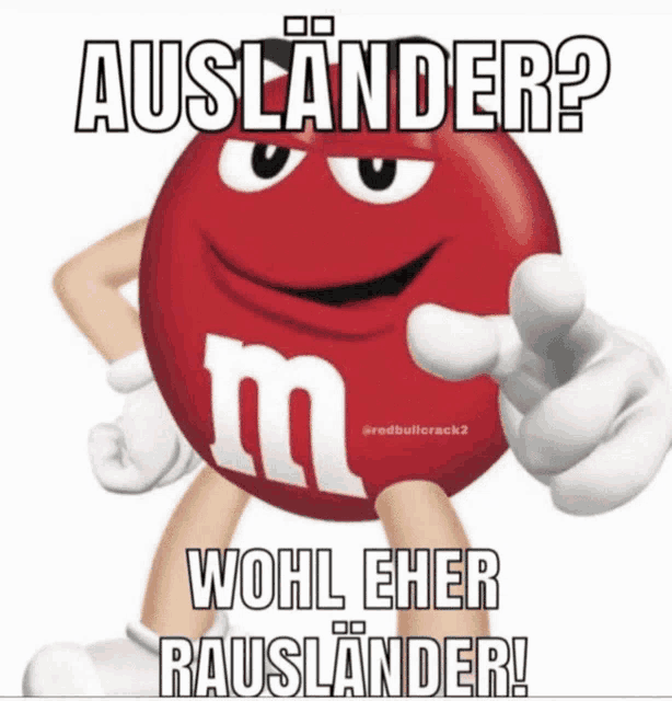 a picture of a red m & m pointing with the caption auslander