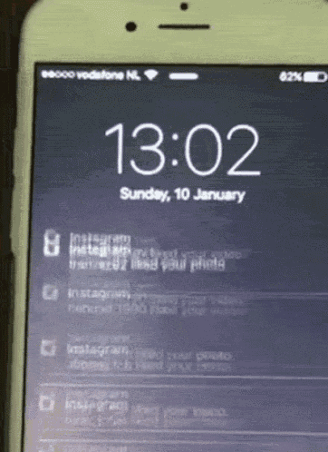 a phone screen shows the time as 13:02 on sunday january 10