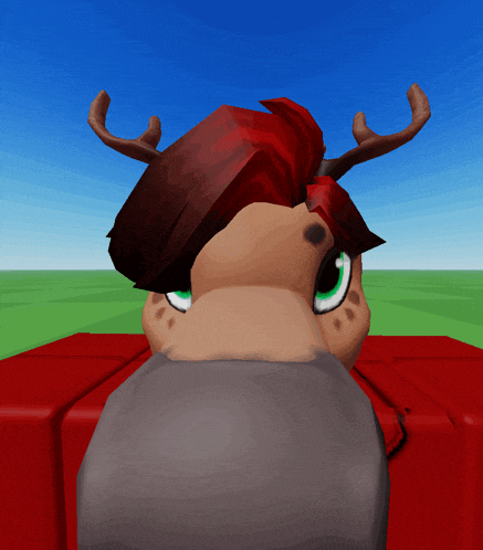 a cartoon character with red hair and antlers is sitting on a red block