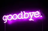 Neon sign with the words “goodbye.”