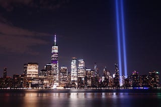 Blue lights shine where the Twin Towers once stood