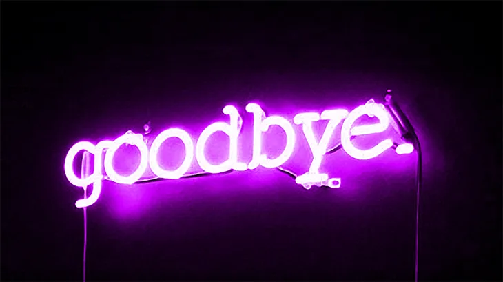 Neon sign with the words “goodbye.”