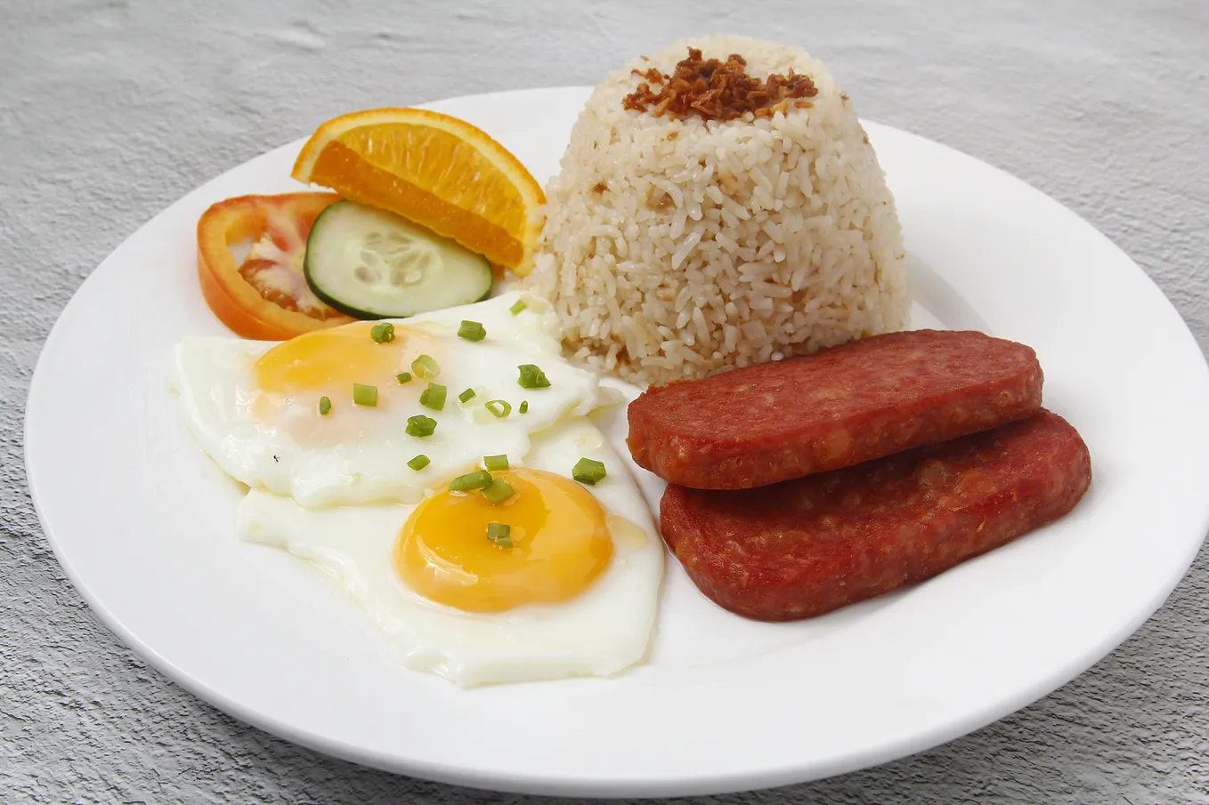 Rice, eggs, spam on a plate