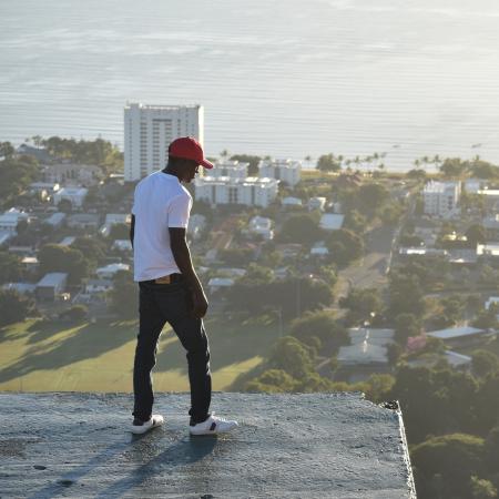 student on top of building