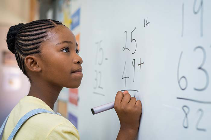 Teacher instructing a class of high schoolers