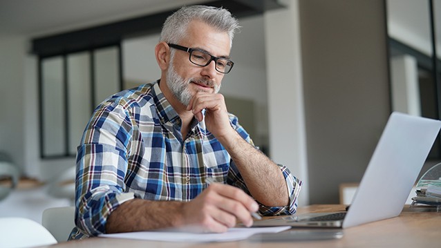 Photo of a student taking notes in an on-demand course