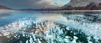 methane bubbles frozen in lake in Canada