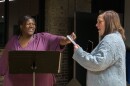 LaWanda Jackson, 48, left, takes the phone from Director Rachel Tibbetts during rehearsal for Prison Performing Arts at Covenant Blu-Grand Center on Thursday, Nov. 7, 2024.