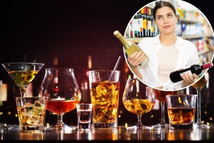 A woman holding a bottle of alcohol with a concern about its potential to cause hangxiety.