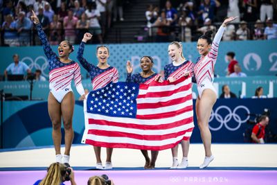 (L-R) Jade Carey, Sunisa Lee, Simone Biles, Jordan Chiles and Hezly Rivera of Team United States celebrate winning the gold medal after the Artistic Gymnastics Women's Team Final on day four of the Olympic Games Paris 2024 at the Bercy Arena on July 30, 2024 in Paris, France.