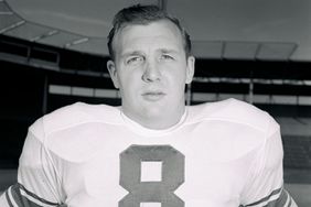 UNITED STATES - JANUARY 09: 1956 NFL Pro Bowl Football Game - East vs. West at Los Angeles Memorial Coliseum. East Team coached by Washington Redskins Joe Kuharich. West Team coach is Los Angeles Rams Sid Gillman. Pictured is West Team player Joseph Schmidt of the Detroit Lions, #8, Linebacker